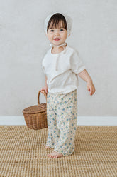 Baby wearing Lyla floral oat pants – wide leg flower print pants outfit by Avauma